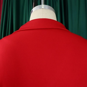Detail of red blazer back showing high-quality fabric texture and structured collar