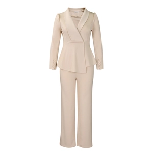 Detail showing elegant peplum top sleeve with four matching buttons in apricot beige