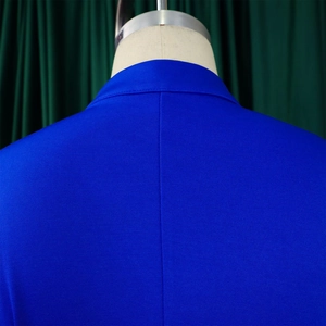 Close-up of bright blue woven blazer neckline and shoulder seams on a mannequin