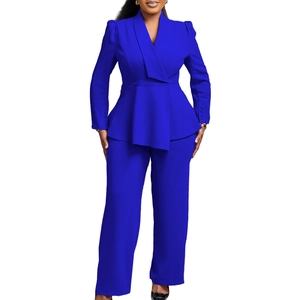 Detail of royal blue peplum blazer and wide-leg trousers set with elegant ruffle hem
