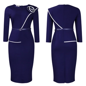 Detail of navy blue pencil dress featuring a white rose shoulder applique and slim waist belt