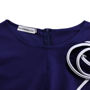 Detail of elegant navy dress neckline with concealed zipper and white piping accents