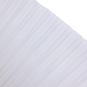 Detailed macro view of white pleated fabric texture with neat accordion folds on a top
