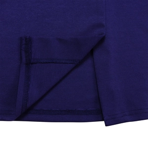 Macro shot of dark blue dress slit showing precision stitching and fabric texture