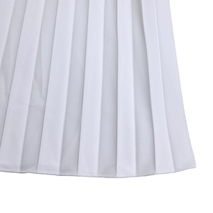 Detail view of white pleated fabric with fine accordion folds and neat hem stitching