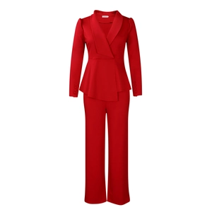 Detail of red business suit set featuring ruffle hem top and wide-leg trousers