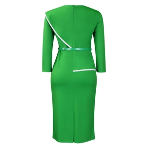 Detail view of the back of a slim-fit green pencil dress with white geometric trim