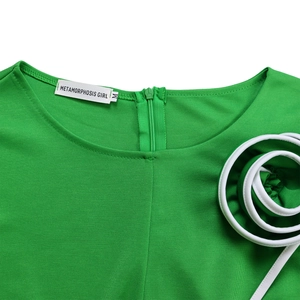 Detail of green knit dress neckline with invisible zipper and white spiral trim