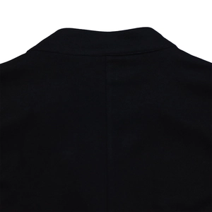 Detail view of the high-quality black fabric texture on the back collar and shoulder area