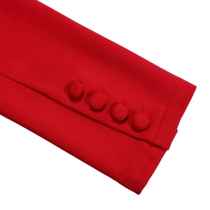 Detail of elegant red sleeve cuffs with four matching fabric-covered decorative buttons