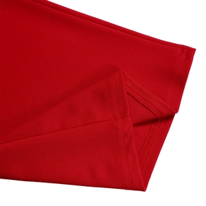 Macro view of red knit fabric texture and high-quality flatlock stitching on hem