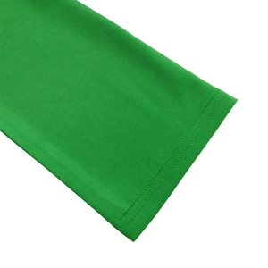 Close-up of emerald green knit dress cuff showing precise double-needle stitching detail