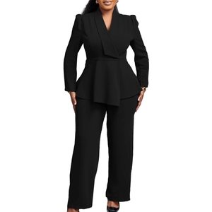 Detail of elegant black two-piece business set with peplum blazer and wide-leg trousers