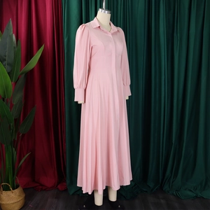 Detail view of pink long sleeve shirt dress with puff sleeves and A-line waist