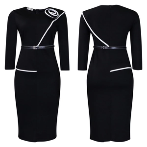 Detail view of black long sleeve pencil dress with white trim and 3D floral accent