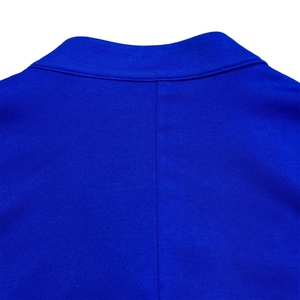 Close-up of the professional stitching and texture on the royal blue suit jacket