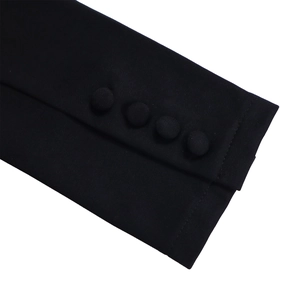 Detail of elegant black sleeve cuffs with four decorative fabric-covered buttons and fine stitching