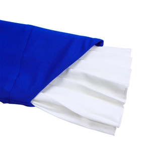 Detailed close-up of blue twill fabric with contrasting white pleated layers