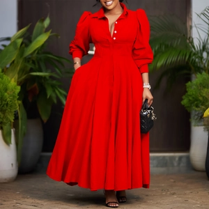 Detail of red flare dress showing crisp lapel collar, buttons and long puff sleeves