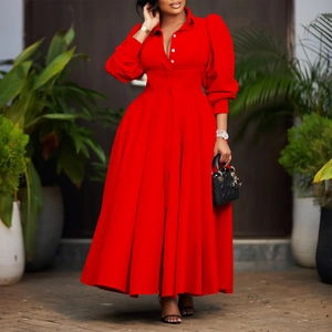 Detail of red shirt dress featuring elegant puff sleeves and white contrast buttons