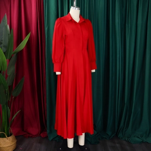 Detail of red lantern sleeves and waist tailoring on a long-sleeved shirt dress