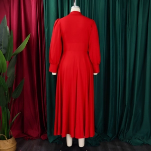 Rear view of elegant red long-sleeve dress with puff sleeves and flared hemline
