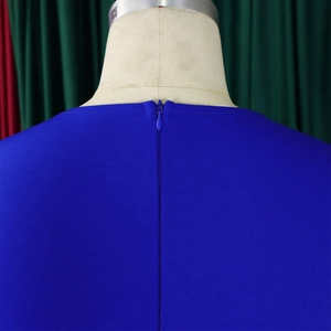 Detail of royal blue dress showing the back invisible zipper and textured fabric