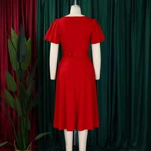 Detail view of red flared dress back with invisible zipper and elegant flutter sleeves