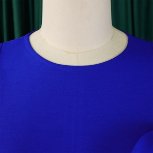 Detail of round neckline with double-stitch sewing on dark blue micro-texture fabric
