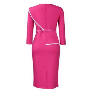 Detail view of pink pencil dress showing white contrast trim and elegant back slit design