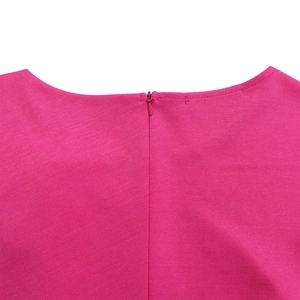 Detail of rose pink dress featuring a seamless invisible zipper and textured fabric