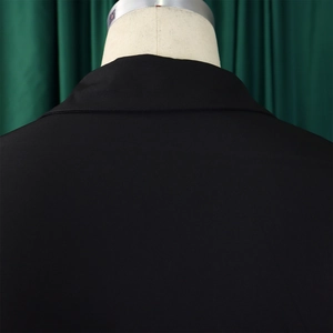 Detail of the high-quality stitching on the back collar and shoulders of the black dress
