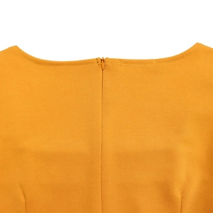 Detailed view of back neckline with seamless invisible zipper on mustard yellow dress