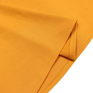 Macro shot of yellow twill fabric showing detailed stitching and hem finish on the dress