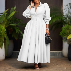 Elegant white shirt dress featuring long lantern sleeves and wide flowing pleated skirt