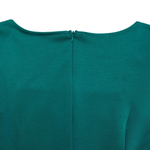 Detail view of the seamless invisible zipper and square neckline on dark green summer dress