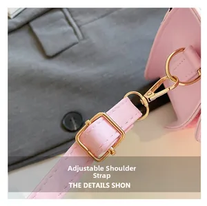 Close-up of adjustable pink PU leather shoulder strap with light gold metal hardware