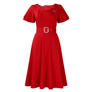 Detail of red square-neck vintage dress with ruffle sleeves, matching belt and flower brooch