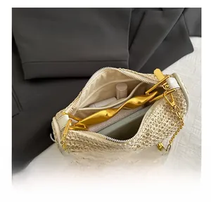 Macro view showing the internal capacity and woven texture of the beige evening handbag