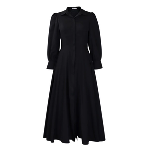 Detail of the high-waisted pleated skirt and lapel collar on this black long sleeve dress