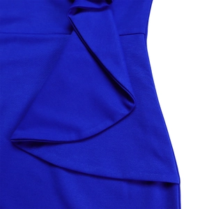 Detail of royal blue dress showing dense ribbed texture and layered ruffle sleeve design