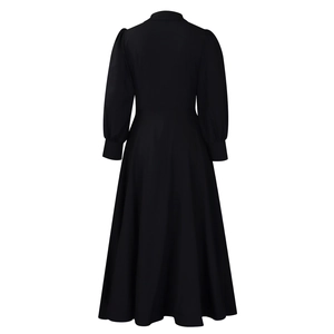 Back view of elegant long sleeve black maxi dress with flared skirt and high waist