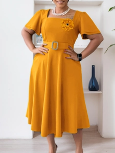 Bright yellow square neck midi dress with floral detail and waist belt shown on model