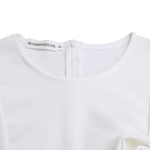 Detail of round neckline and invisible zipper closure on white knitted dress