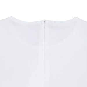 Detail view of invisible zipper closure on back of elegant white ruffled dress