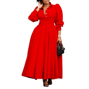 Detailed shot of long-sleeved red shirt dress featuring white buttons and flared hem