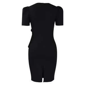 Detail view of the back of a black bodycon dress with hidden zipper and small hem slit
