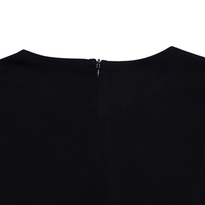 Macro detail of high-quality invisible back zipper on a black woven dress neckline