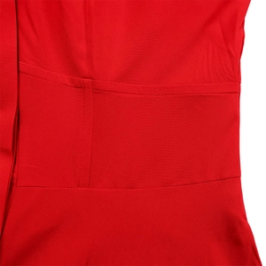 Close-up of red plain weave fabric showing detailed stitching and premium cotton texture