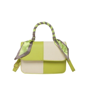Green and cream panelled handbag with decorative floral scarf on the round handle